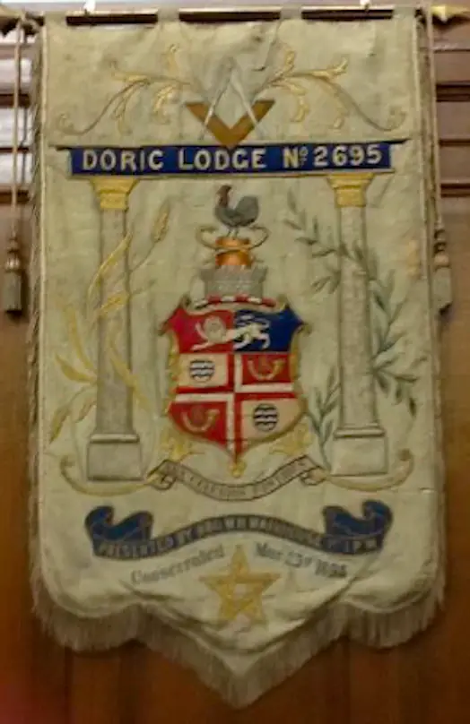 Doric Lodge banner featuring two Doric columns, the Square and Compasses and a coat of arms.